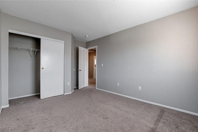 unfurnished bedroom featuring a closet and carpet