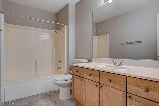 full bathroom featuring washtub / shower combination, vanity, tile patterned floors, and toilet