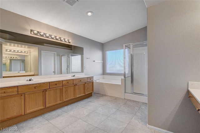 bathroom featuring plus walk in shower, vaulted ceiling, and vanity