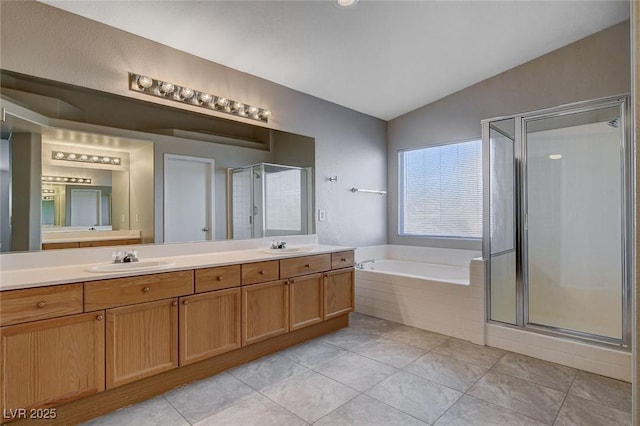 bathroom with tile patterned floors, lofted ceiling, vanity, and shower with separate bathtub