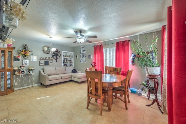 dining room featuring a textured ceiling and ceiling fan