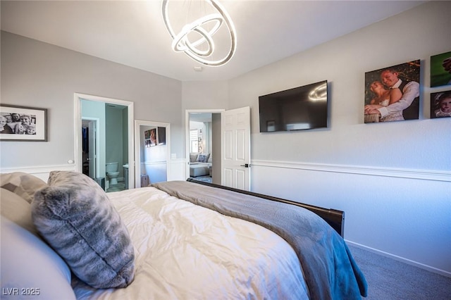 carpeted bedroom with ensuite bath