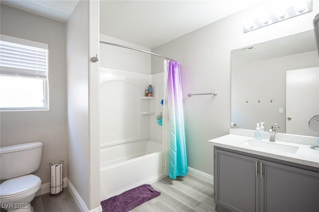 full bathroom with shower / tub combo, toilet, vanity, and wood-type flooring