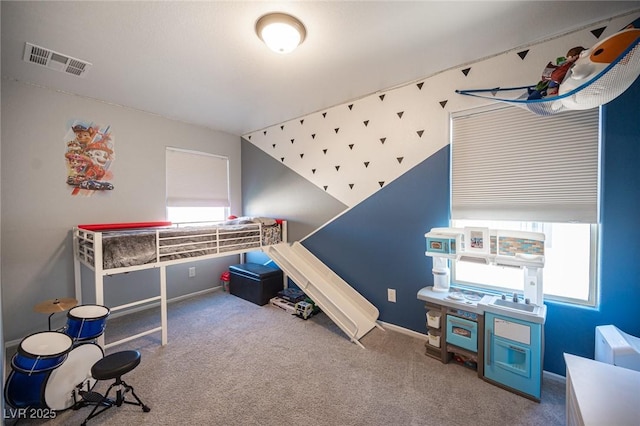 bedroom featuring lofted ceiling and carpet flooring