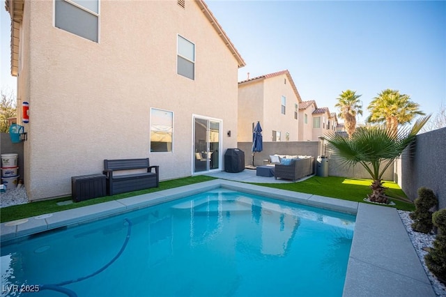 view of pool featuring a lawn and outdoor lounge area