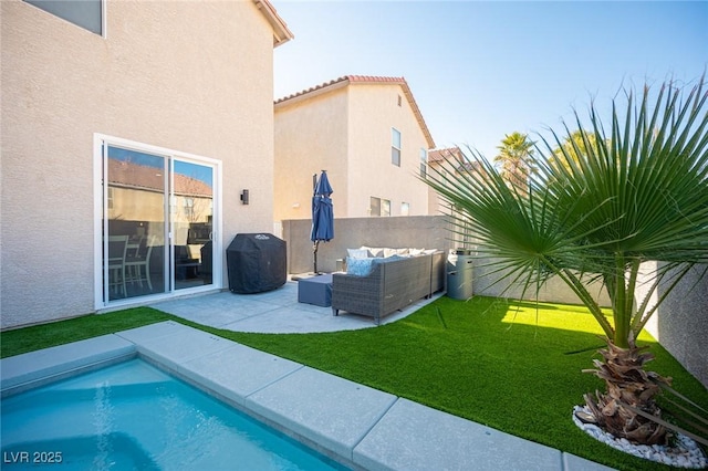 exterior space featuring a yard, an outdoor hangout area, a fenced in pool, and a patio area