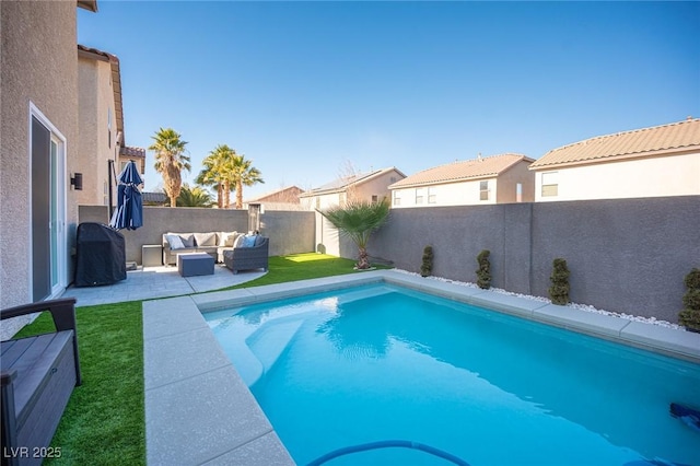 view of swimming pool with grilling area, an outdoor hangout area, and a patio