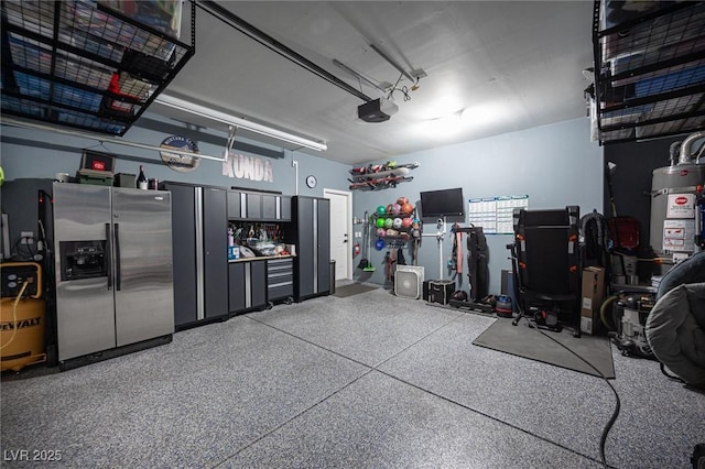 garage with a garage door opener, stainless steel fridge with ice dispenser, and gas water heater