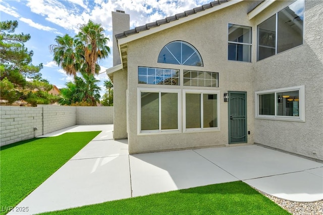 back of house with a patio area