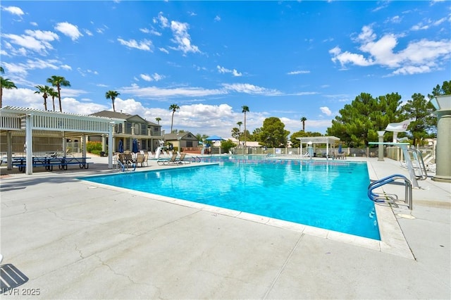 view of swimming pool with a pergola and a patio