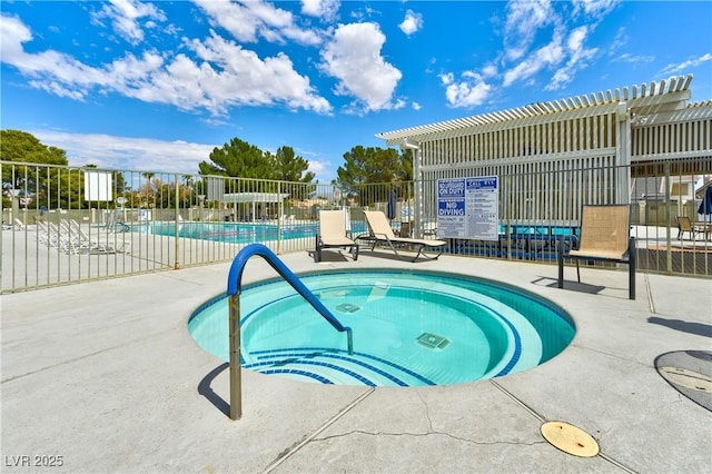 view of swimming pool with a patio, a hot tub, and a pergola