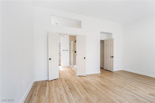 empty room with light hardwood / wood-style floors