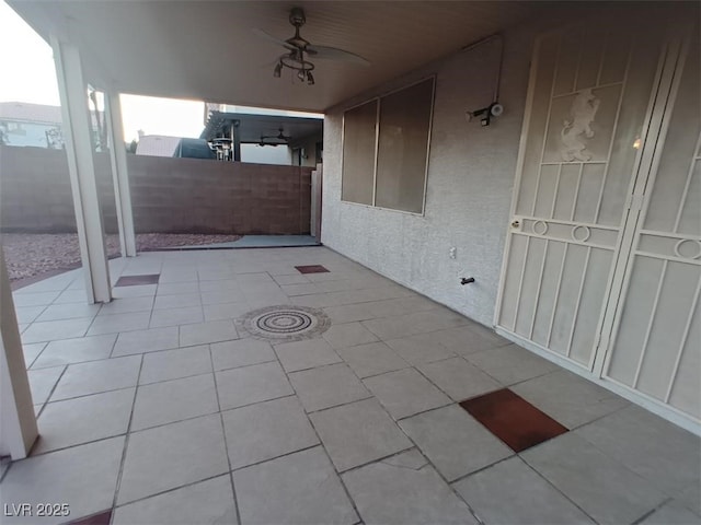 view of patio featuring ceiling fan