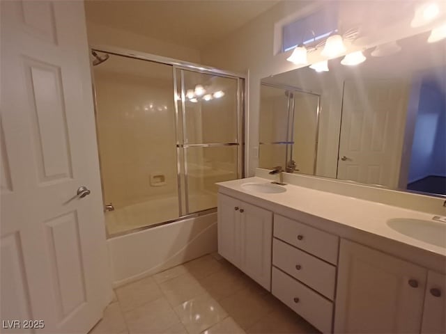 bathroom with vanity, tile patterned floors, and combined bath / shower with glass door