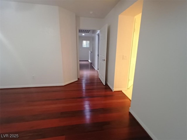 hallway featuring dark wood-type flooring