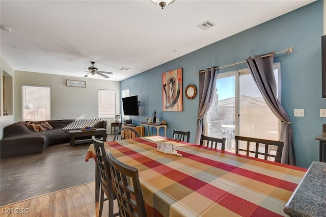 dining room featuring ceiling fan and hardwood / wood-style flooring