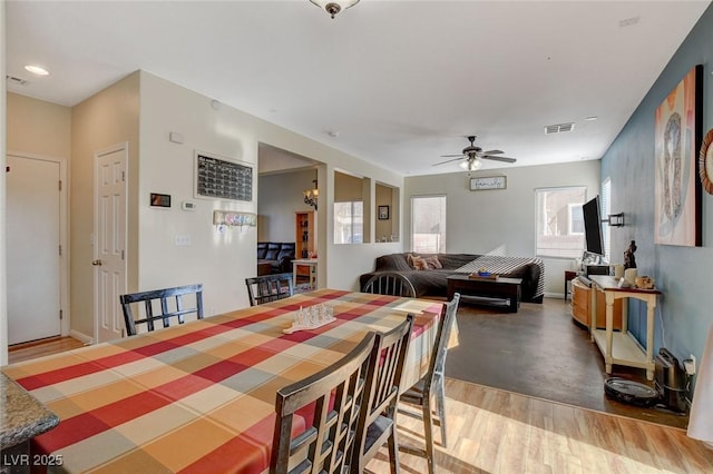 dining room featuring hardwood / wood-style floors and ceiling fan