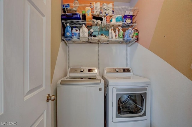 washroom featuring washing machine and dryer