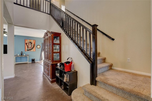 stairway with concrete flooring