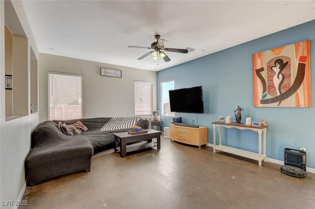 living room featuring concrete floors and ceiling fan