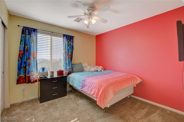 carpeted bedroom with ceiling fan