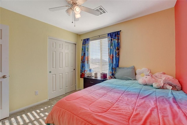 bedroom featuring a closet, ceiling fan, and carpet