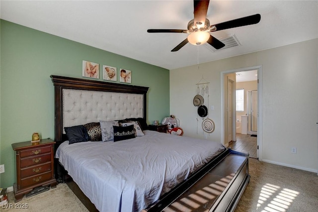 carpeted bedroom featuring ensuite bathroom and ceiling fan