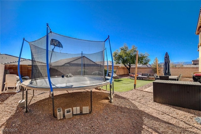 view of yard featuring a trampoline