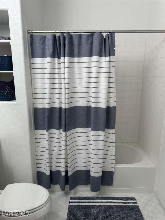 bathroom with toilet, tile patterned flooring, and shower / tub combo with curtain