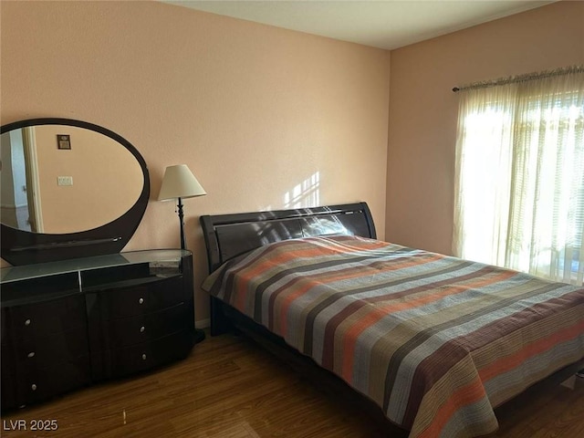 bedroom featuring dark wood-type flooring