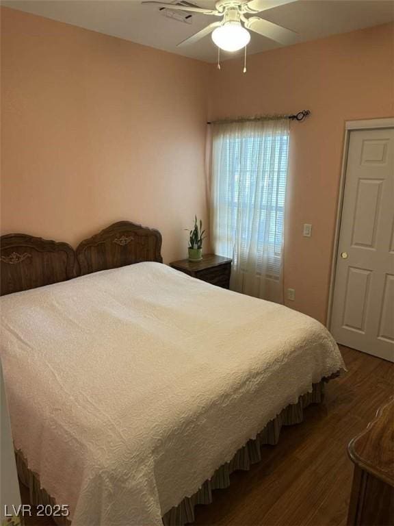 bedroom featuring ceiling fan and dark hardwood / wood-style flooring