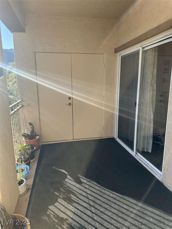 view of patio featuring a balcony