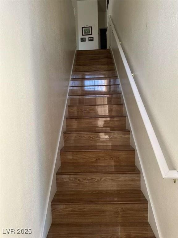 staircase featuring hardwood / wood-style floors