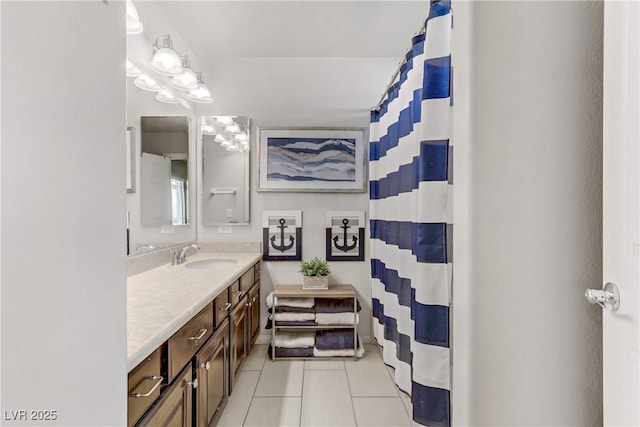 bathroom with tile patterned flooring and vanity