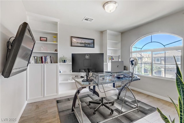 home office featuring light hardwood / wood-style floors