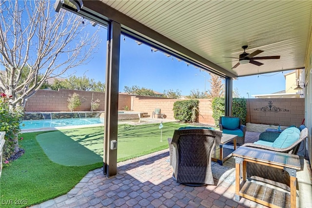 view of patio / terrace featuring pool water feature, ceiling fan, and outdoor lounge area