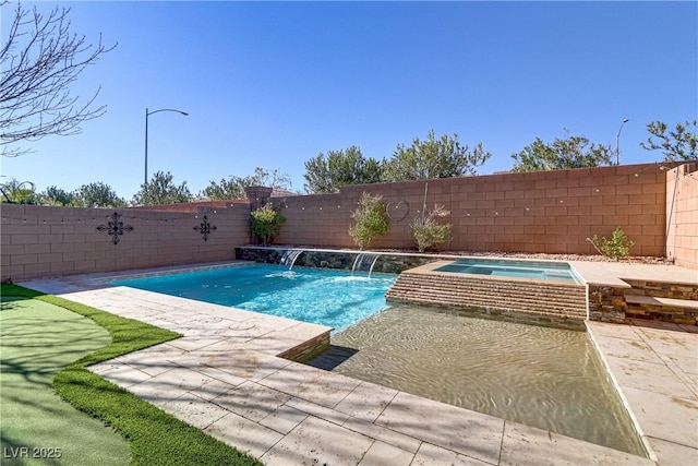 view of swimming pool with pool water feature, an in ground hot tub, and a patio