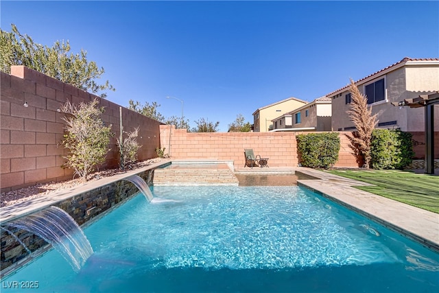 view of swimming pool with pool water feature