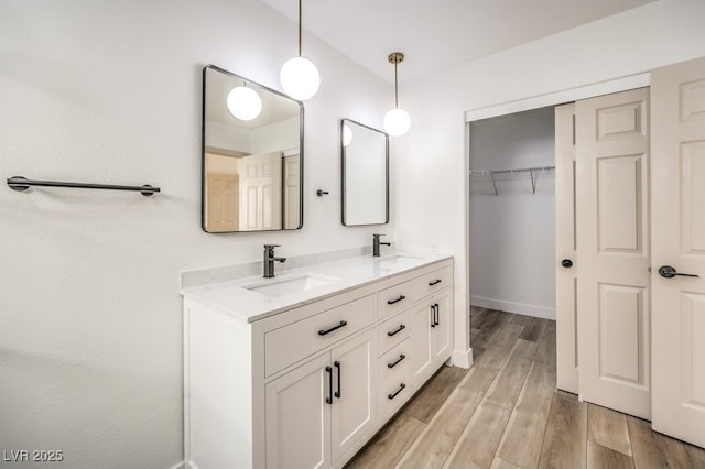 bathroom with vanity and hardwood / wood-style floors