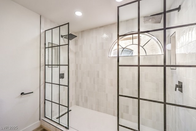 bathroom with tiled shower