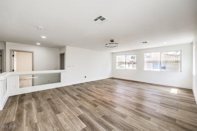 unfurnished room featuring light hardwood / wood-style floors