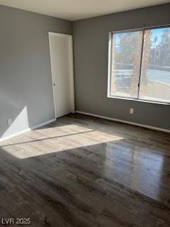 empty room with wood-type flooring