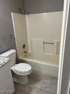 full bathroom featuring vanity, shower / bathtub combination, and toilet