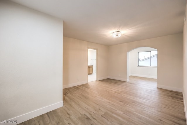 spare room featuring light hardwood / wood-style floors