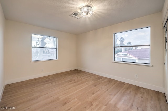 empty room with light wood-type flooring