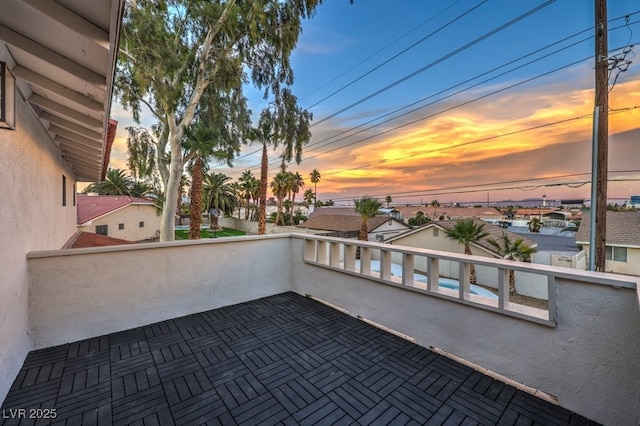 patio terrace at dusk with a balcony