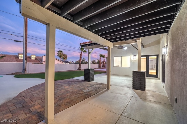 view of patio terrace at dusk