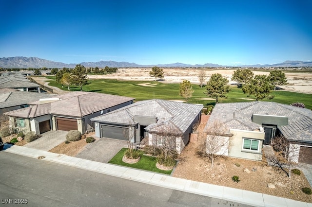 birds eye view of property featuring a mountain view