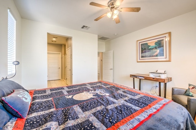 bedroom with ceiling fan and light tile patterned floors