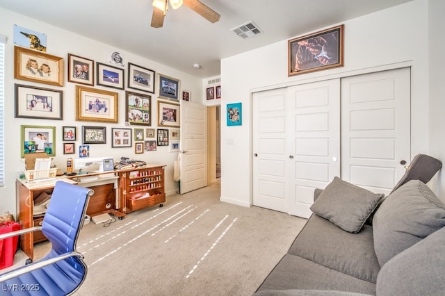 office with ceiling fan and light colored carpet